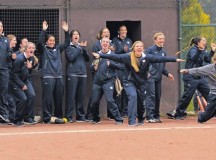 Members of the University of Notre Dame softball team celebrate during a scrimmage against the Ramstein Lady Rams Oct. 21 on Ramstein. The Lady Rams defeated the UND team by a score of 11-7.