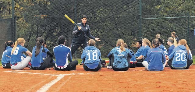 Lizzy Ristano, University of Notre Dame associate softball coach, gives instructions to members of the Ramstein High School Royals varsity softball team Oct. 21 on Ramstein. The UND coaching staff and players held an instructional softball clinic, a scrimmage and a Q&A session during their visit to the base.