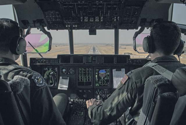 Two U.S. Air Force pilots prepare to land an 86th Airlift Wing C-130J Super Hercules Sept. 9 at Diyarbakir Air Base, Turkey. The aircrew delivered essential cargo to the 435th Contingency Response Group deployed to DAB in support of the build up of U.S. Air Forces Central Command’s personnel recovery deployment site and facilities at the Turkish installation.