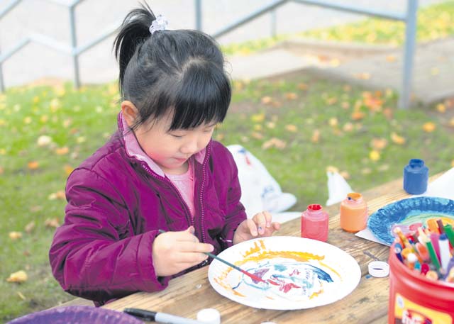 Children of Soldiers assigned to the 21st Theater Sustainment Command’s Special Troops Battalion participate in arts and crafts during a STB Fall Festival Sept. 26 on Daenner Kaserne.