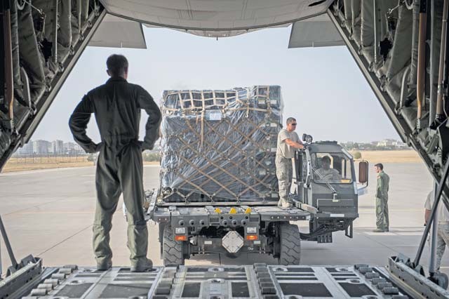 Senior Airman Dustin Dixon, 435th Contingency Response Squadron loadmaster, oversees the offload from a C-130J Super Hercules Sept. 15 at Diyarbakir Air Base, Turkey. The equipment delivery is in support of the 435th CRG’s build up of U.S. Air Forces Central Command’s personnel recovery deployment site and facilities at DAB. The CRG serves as U.S. Air Forces in Europe and Air Forces Africa's only expeditionary open-the-base force.