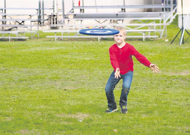 A child from the 21st Theater Sustainment Command’s Special Troops Battalion attempts to catch a flying disk during a STB Fall Festival Sept. 26 on Daenner Kaserne.
