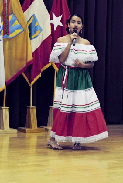 Courtesy photo Angela Chavarria performs a traditional ‘Cumbia,’ a type of Mexican song, during the Hispanic Heritage celebration hosted by 21st Theater Sustainment Command Oct. 7 at the Kaiserslautern Community Activity Center on Daenner Kaserne. The celebration included a historical presentation, a guest speaker, a food tasting, and music and dance demonstrations.
