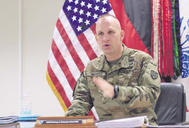 Command Sgt. Maj. Rodney Rhoades, senior enlisted leader of the 21st Theater Sustainment Command and president of the Oct. 22 Sergeant Morales Club board, counsels a candidate during the event conducted at Kleber Kaserne.