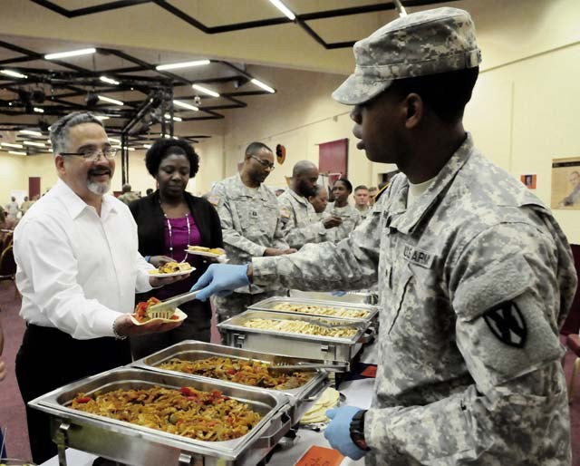 Courtesy photo Spc. Kentrice Melvin, 21st Special Troops Battalion, serves fajitas during the Hispanic Heritage celebration hosted by the 21st Theater Sustainment Command Oct. 7 at the Kaiserslautern Community Activity Center on Daenner Kaserne.