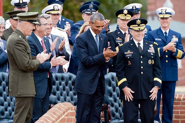 Photo by Sgt.1st Class Clydell Kinchen President Barack Obama, Secretary of Defense Ash Carter and Marine Gen. Joseph F. Dunford Jr., the new chairman, applaud outgoing Chairman of the Joint Chiefs of Staff Army Gen. Martin E. Dempsey during the change of responsibility ceremony at Summerall Field on Joint Base Myer-Henderson Hall in Arlington, Va., Sept. 25.