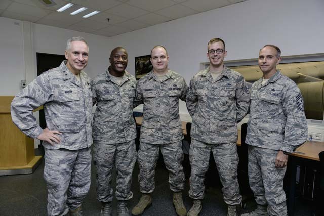 Maj. Gen. Frederick H. “Rick" Martin, U.S. Air Force Expeditionary Center commander, poses for a group photo with Airmen from the 721st Aircraft Maintenance Squadron Oct. 13 on Ramstein. During his visit to the 721st AMXS, superior performers from the unit explained the aircraft deicing process and their winter execution plan.
