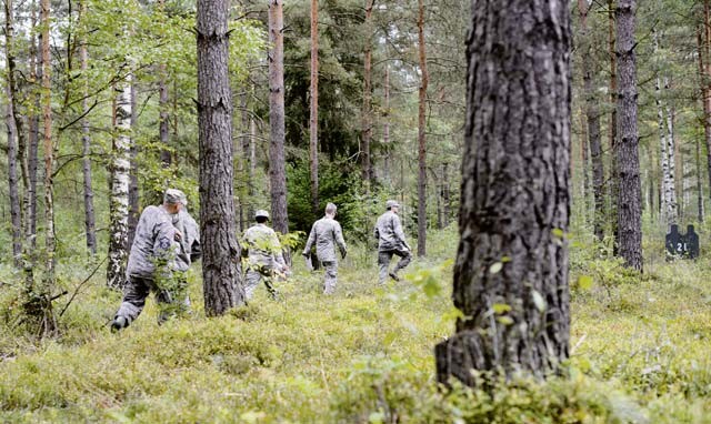 Airmen from the 7th Weather Squadron navigate through the Grafenwoehr Training Area land navigation course during Cadre Focus Sept. 16. The Airmen took part in a revamped Cadre Focus exercise designed to improve their basic Army and forecasting skills.