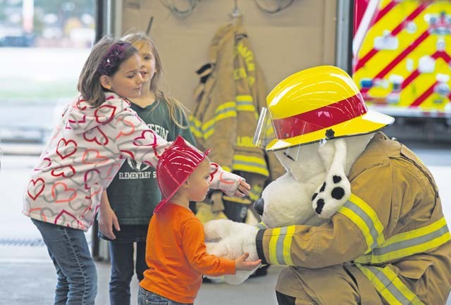 Sparky the Fire Dog interacts with children attending an open house Oct. 8 on Ramstein. The event was hosted by the 86th Civil Engineer Squadron to promote Fire Prevention Week.