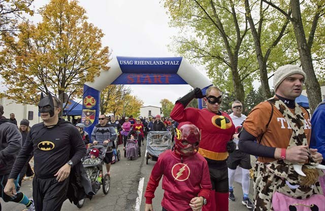 Participants of the Red Ribbon Run Superhero 5K event begin running Oct. 17 at Sembach Kaserne. The 5K run was in support of Red Ribbon Week, which is the oldest and largest drug prevention campaign in the United States.