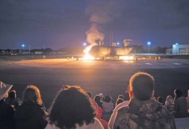 Attendees of an open house watch as a fire-training aircraft burns Oct. 8 on Ramstein.