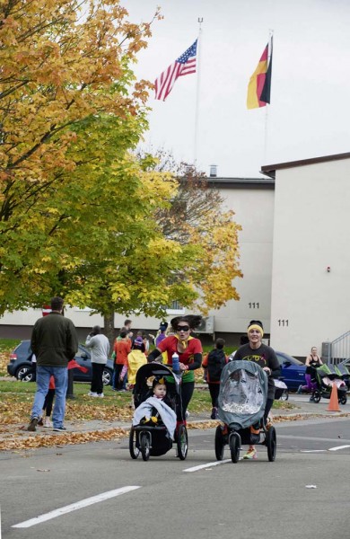 Runners participate in the Red Ribbon Run Superhero 5K event. The run was stroller friendly.
