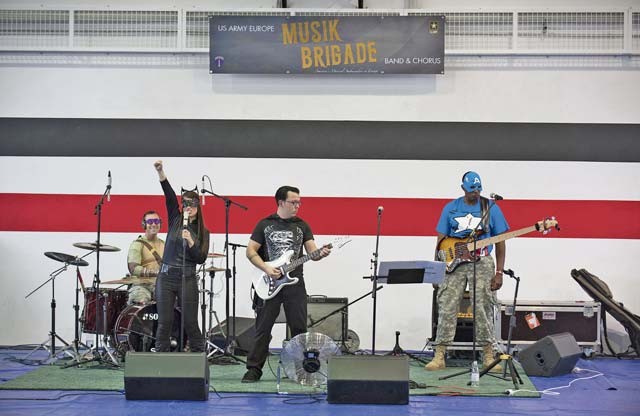 The Musik Brigade, Soldiers with the U.S. Army Europe Band and Chorus, perform for an audience during the Red Ribbon Run Superhero 5K event.