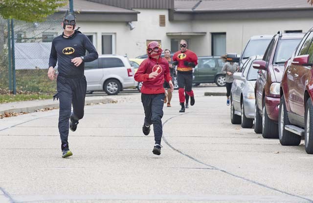 Runners participate in the Red Ribbon Run Superhero 5K event Oct. 17 at Sembach Kaserne.