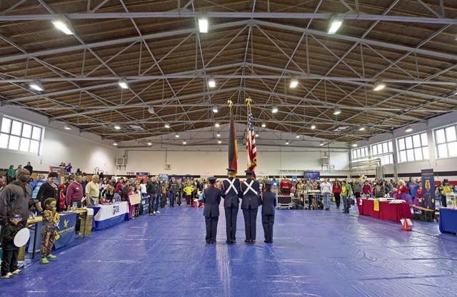 Members of the Ramstien Junior ROTC display the colors for the audience during the Red Ribbon Run Superhero 5K event.