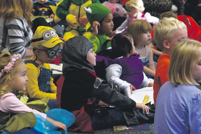 KMC children listen to a story during the Ramstein Library’s "Spooky Story Time" Oct. 29. The children were encouraged to wear a Halloween costume to the event.