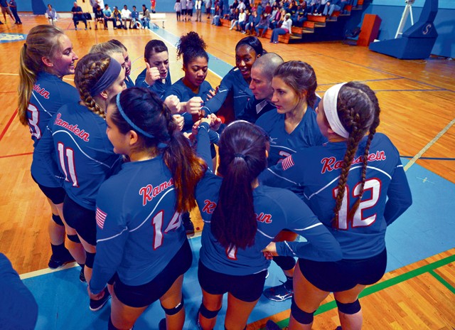Members of the Ramstein Royals volleyball team huddle before their match during the Department of Defense Dependents Schools Europe volleyball championships Nov. 7 on Ramstein. Ramstein was one of 26 teams from three divisions competing in the DODDS European volleyball championships.