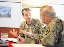 Lt. Col. Alcuin Johnson of the United Kingdom’s 77th Brigade (left), discusses his unit’s capabilities with Col. Miguel Castellanos, commander of the 361st Civil Affairs Brigade, 7th Mission Support Command. The two brigades established a formal partnership under the partnership program of their respective higher headquarters, the U.K.’s Force Troops Command and the 21st Theater Sustainment Command, during a recent visit to the 21st TSC by the FTC’s staff Nov. 5.