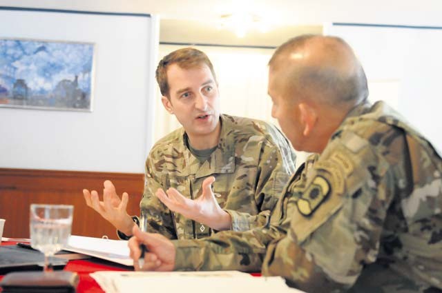 Lt. Col. Alcuin Johnson of the United Kingdom’s 77th Brigade (left), discusses his unit’s capabilities with Col. Miguel Castellanos, commander of the 361st Civil Affairs Brigade, 7th Mission Support Command. The two brigades established a formal partnership under the partnership program of their respective higher headquarters, the U.K.’s Force Troops Command and the 21st Theater Sustainment Command, during a recent visit to the 21st TSC by the FTC’s staff Nov. 5.