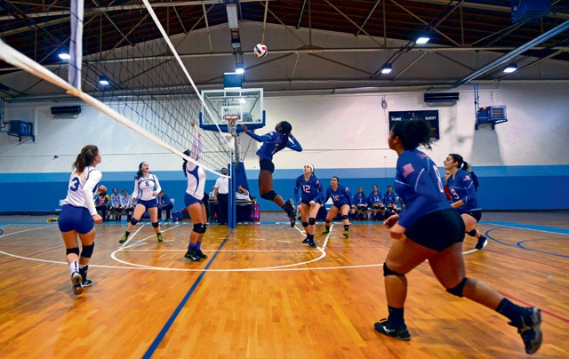 Denee Lawrence, Ramstein Royals volleyball team member, spikes the ball during the Department of Defense Dependents Schools Europe volleyball championships Nov. 7 on Ramstein. Lawrence was awarded the most valuable player honors for the Royals within the Division I category.