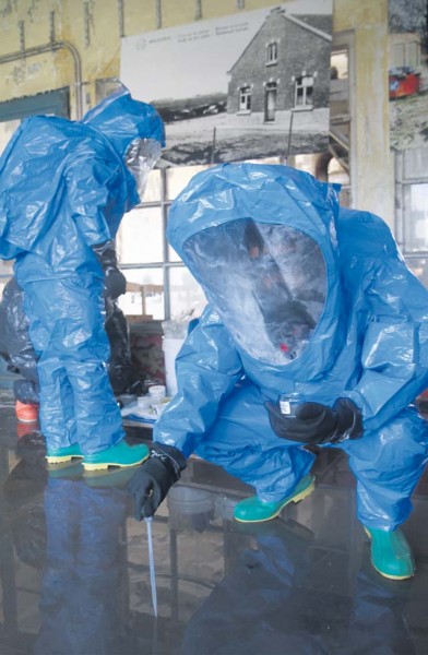 Soldiers from the 773rd Civil Support Team employ sophisticated gear to determine contaminants during a hazardous material scenario at Chemical, Biological, Radiological and Nuclear Week 2015.