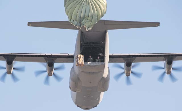 A container delivery system airdrops from a C-130J Super Hercules assigned to the 37th Airlift Squadron Oct. 27 at Powidz Air Base, Poland. The drop was performed during Aviation Detachment 16-1, a flying training deployment that helps crews maintain their readiness and interoperability with NATO allies.