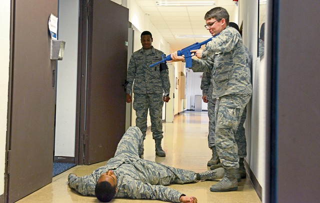 Photo by Airman 1st Class Tryphena Mayhugh A student in the Expeditionary Active Shooter Training class checks on a fallen Airman during a simulated active shooter scenario Nov. 5 on Ramstein. The course is a requirement for deploying Airmen and includes a hands-on practical portion that allows the students to use the skills they were taught in the course.