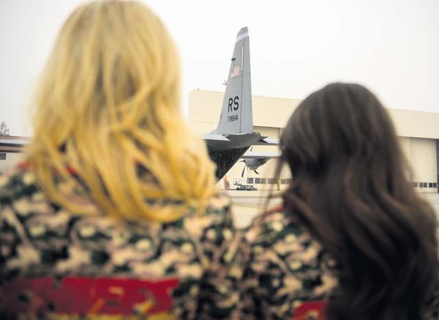 Two Kansas City Chiefs cheerleaders view an 86th Airlift Wing C-130J Super Hercules during a base tour Nov. 2 on Ramstein. The cheerleaders learned about the base and the capabilities it provides to the European area of operation and beyond.