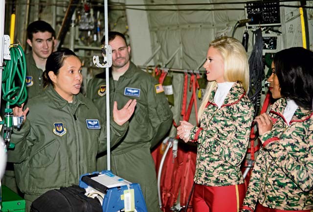 Capt. Stefhanie Jimenez, 86th Aeromedical Evacuation Squadron flight nurse, explains her job to Kansas City Chiefs cheerleaders during a base tour Nov. 2 on Ramstein. The cheerleaders learned about Ramstein’s history, mission and capabilities during the tour.