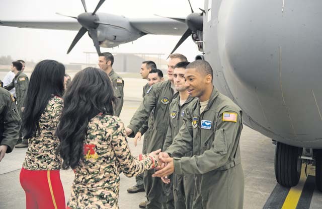 Airmen from the 86th Airlift Wing thank the Kansas City Chiefs cheerleaders for visiting them during a tour of Ramstein Nov. 2.