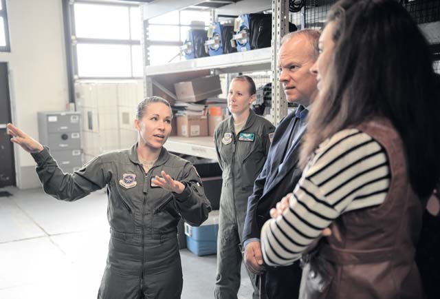 Senior Airman Beverly Spencer, 10th Expeditionary Aeromedical Evacuation Squadron technician, briefs Wyoming Governor Matt Mead and his wife on the equipment used by the 10th EAES Oct. 26 on Ramstein. Mead visited with Wyoming Air National Guardsmen to see how they contribute to the Air Force mission.