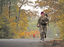 Airman 1st Class Kevin Leyden, 786th Civil Engineer Squadron explosive ordnance disposal technician, jogs along a trail during a ruck march Oct. 30 on Ramstein. The ruck march mirrored an EOD course where participants traversed three miles, climbed a six-foot wall and carried jerry cans for 50 meters all while wearing a 50-pound pack as part of the event. The course was held to help raise money for the 2015 Combined Federal Campaign-Overseas. The mission of the CFC-O is to support and promote philanthropy through a voluntary program that is employee-focused, cost-efficient and effective in providing all federal employees the opportunity to improve the quality of life for all.