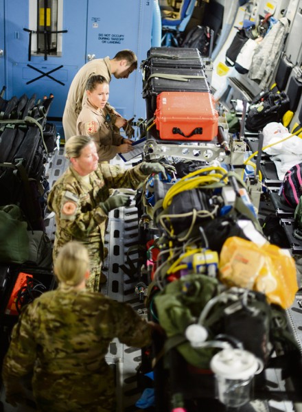 Medical personnel construct an aeromedical evacuation zone inside of a C-17 Globemaster III Nov. 10 on Ramstein. A variety of medical personnel, including Ramstein’s 10th Expeditionary Aeromedical Evacuation Squadron, flew to a deployed location to bring injured Airmen, Soldiers and Sailors to medical facilities capable of treating their injuries.