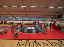 Members from the KMC warm up prior to competing in the 7th Mission Support Command's Army Combatives Tournament Dec. 4 on Kleber Kaserne. The tournament afforded Soldiers and Airmen an opportunity to learn from one another and apply their combatives skills against other competitors.