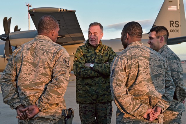 Photo by Staff Sgt. Leslie Keopka U.S. Marine Corps Gen. Joseph F. Dunford Jr., chairman of the Joint Chiefs of Staff, visits Airmen from the 435th Air Ground Operations Wing during the 2015 USO Holiday Troop Tour, Dec. 9 on Ramstein. Ramstein was the final stop on the tour, after places such as Bahrain and Djibouti.