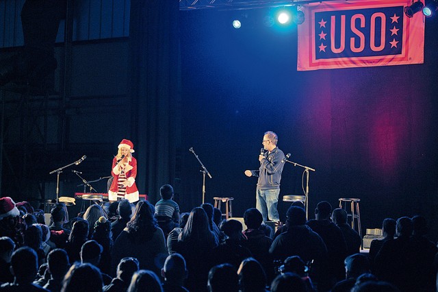 Photo by Staff Sgt. Timothy Moore Actress Elizabeth Banks and director David Wain talk with the crowd during the 2015 USO Holiday Troop Tour Dec. 9 on Ramstein.