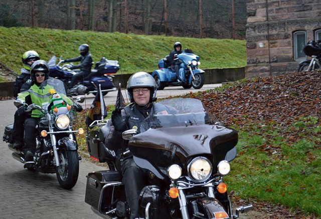 Leather-clad members of the Warrant Officers Association, Rheinland-Pfalz Silver Chapter, families and volunteers drive toward Landstuhl Dec. 5 during a "Toy Run for Kids." Around two dozen of Santa's "bad-boy" helpers, many of them active-duty warrant officers serving with the 21st Theater Sustainment Command, traded reindeer and sleighs for motorcycles, delivering a full truck-sized load of Christmas cargo as well as several hundred euro in cash donations for area children. Participants in the toy convoy rode from their rally point at the Kaiserslautern Military Community Center to the Kinderheim Saint Nikolaus Orphanage in Landstuhl.