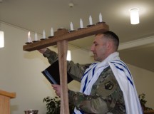 Chaplain (Maj.) Jonathan Zagdanski, 7th Mission Support Command, lights a Menorah to officially begin the celebration of Hanukkah Dec. 6 on Ramstein. The Festival of Lights historically goes back to 168 B.C. to the time of Judas Maccabeaus, who ordered an 80-day celebration following the rededication to the Temple in Jerusalem. Hanukkah runs through Sunday.