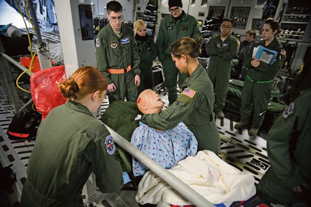 Members of the 86th Aeromedical Evacuation Squadron provide care to a simulated patient as Polish aeromedical evacuation specialists watch Dec. 3 on Ramstein. Three Polish doctors and one paramedic visited Ramstein’s aeromedical facilities to improve their processes.