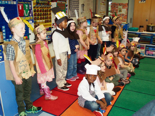 Photo by Trudy Lee Students in Trudy Lee’s  kindergarten class at Landstuhl Elementary Middle School dress up and sing to their families as part of a Thanksgiving celebration. The afternoon also consisted of dancing, joking and a luncheon. 