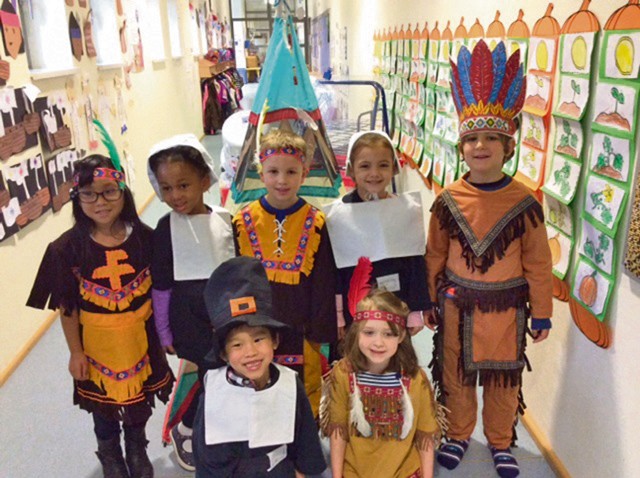 Photo by Elsa Tovar Students in Elsa Tovar's kindergarten class at Landstuhl Elementary Middle School dress up and sing to their families as part of a Thanksgiving celebration. The afternoon also consisted of dancing, joking and a luncheon. 