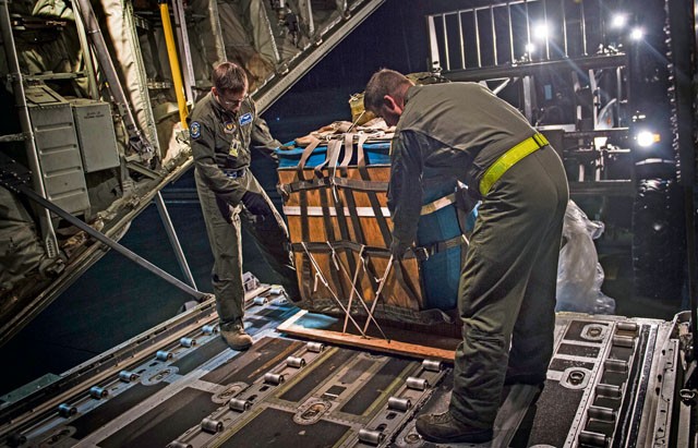 Photo by Staff Sgt. Sara Keller Loadmasters from the 37th Airlift Squadron load water onto an 86th Airlift Wing C-130J Super Hercules Nov. 25 on Ramstein. The water was used to simulate supplies being airdropped during a training mission over Grafenwoehr, Germany.