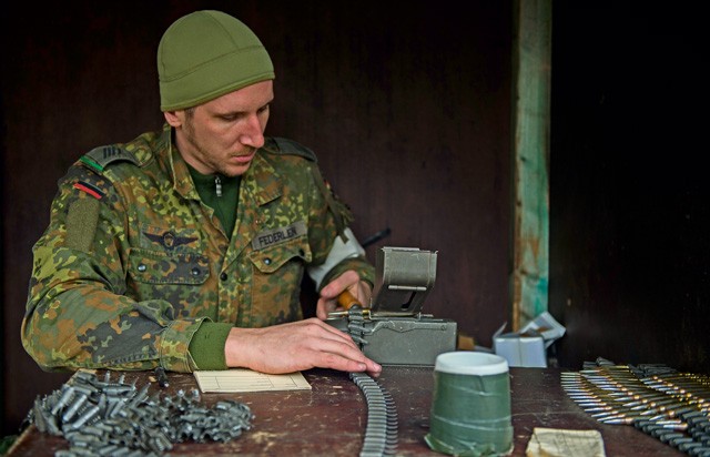 German army Spc. Deniver Federlein, Airborne Infantry Regiment 26, 4th Company Airborne Troop, reloads ammunition for an MG3 machine gun Nov. 18 in Zweibruecken, Germany. German Soldiers hosted members of the 86th Security Forces Squadron as they attempted to earn the “Bundeswehr,” German army, marksmanship badge.