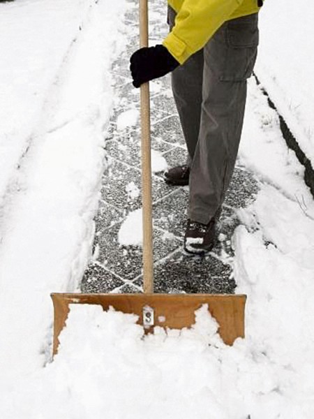 Courtesy photo Residents off base must remove snow between 7 a.m. and 8 p.m. A path large enough for two people to get by must be cleared.