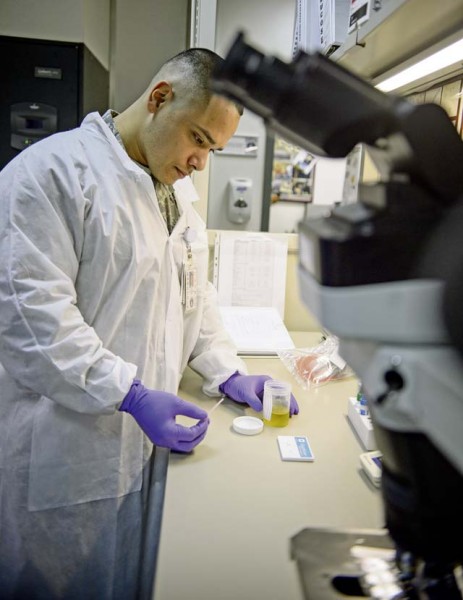 Tech. Sgt. Jose Obregon, 435th Contingency Response Support Squadron independent duty medical technician, conducts an expeditionary pregnancy test during a training session Dec. 18 on Ramstein. Obregon is one of three IDMTs who are qualified to conduct a variety of medical procedures normally performed by nurses and doctors while in the field.