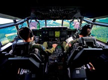 Photo by Senior Airman Nicole Sikorski 
Capts. Sean McKee (right) and Jonathan Recor, C-130J Super Hercules pilots assigned to the 37th Airlift Squadron, fly a C-130J during an orientation flight for German local nationals June 29, 2015, on Ramstein. McKee and Recor flew more than 20 German locals 500 feet off the ground, performing maneuvers and giving them a glimpse of the U.S. Air Force's side of the mission at Ramstein.