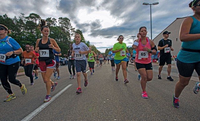 Photo by Airman 1st Class Tryphena Mayhugh KMC members start the 86th Force Support Squadron’s annual Ramstein Half Marathon Aug. 15, 2015, on Ramstein. First, second and third place prizes were awarded to the top male and female times in four age groups, as well as prizes for the top male and female time overall.