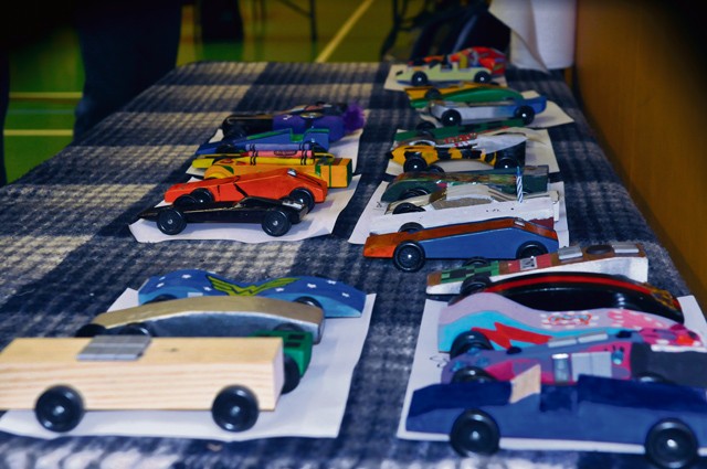 Pinewood Derby cars of all makes and models congregate in a used Scout car lot during the Pack 69 Pinewood Derby held Jan. 23 at Vogelweh Elementary School.