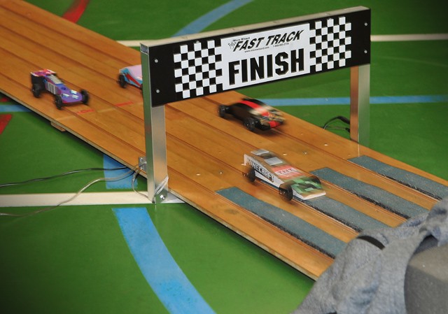 Sibling speedsters race toward a photo finish during the Pack 69 Pinewood Derby held Jan. 23 at Vogelweh Elementary School. 
