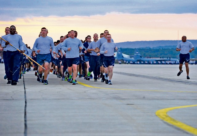 Photo by Airman 1st Class Larissa Greatwood  Airmen from the 86th Comptroller Squadron run in formation while singing jodies during the third tri-wing run of the year Sept. 3, 2015, on Ramstein. The regularly scheduled tri-wing runs are one of the few times all three wings on Ramstein come together to form Team Ramstein.